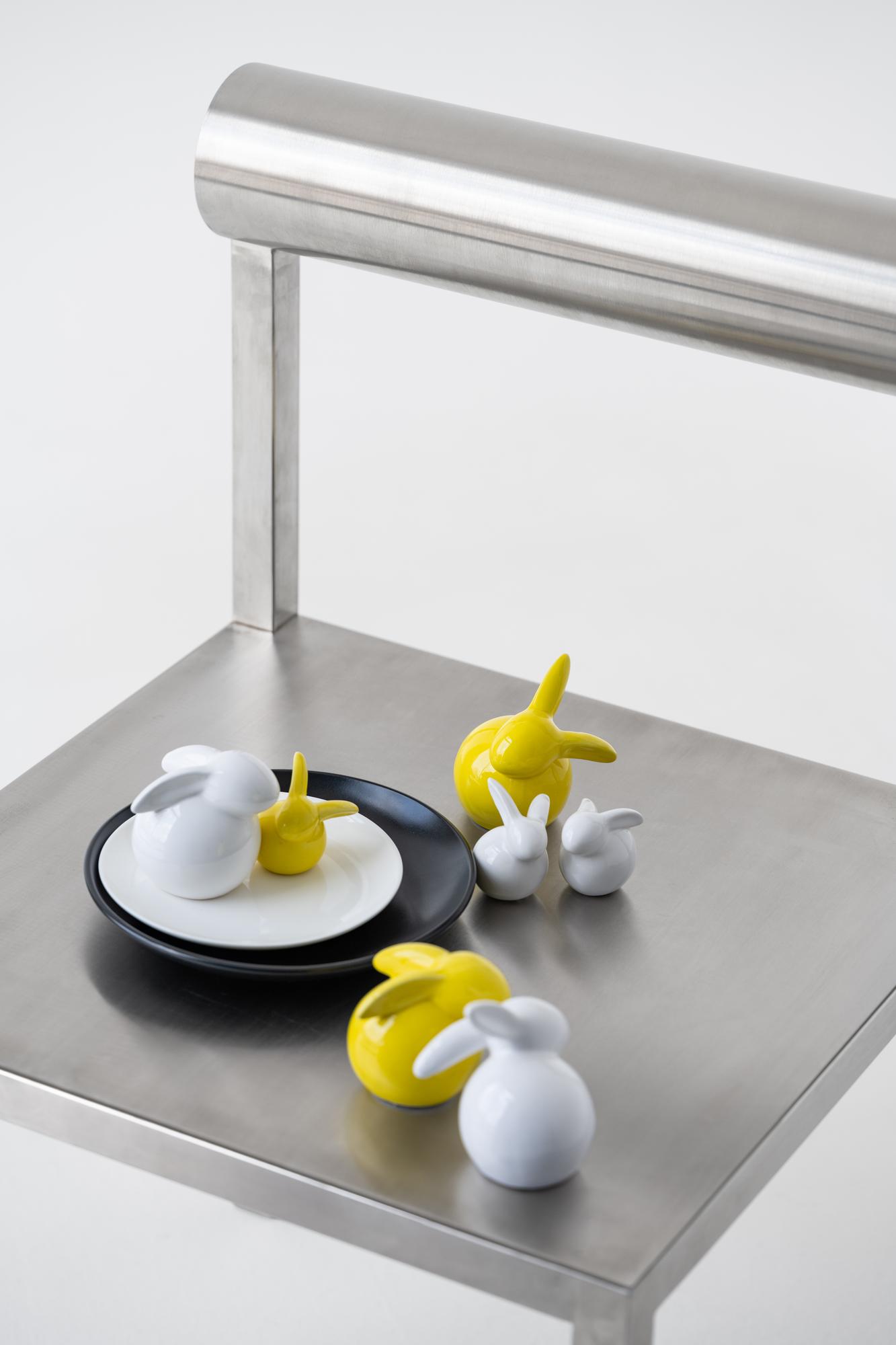 Large editorial shot: futuristic kitchen bench with plated dish